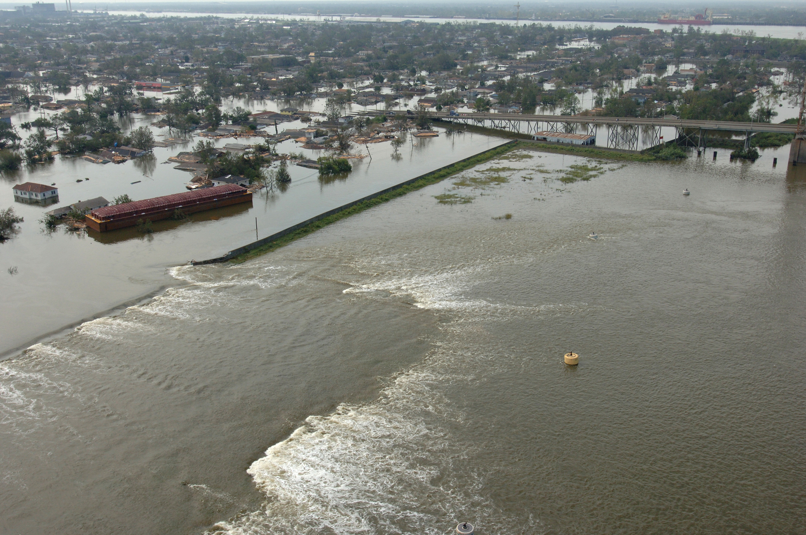 New Orleans, LA--Aerial views of damage caused from Hurricane Katrina the day after the hurricane hit August 30, 2005. This is one of the levee's that has been damaged by the hurricane. Photo by Jocelyn Augustino/FEMA